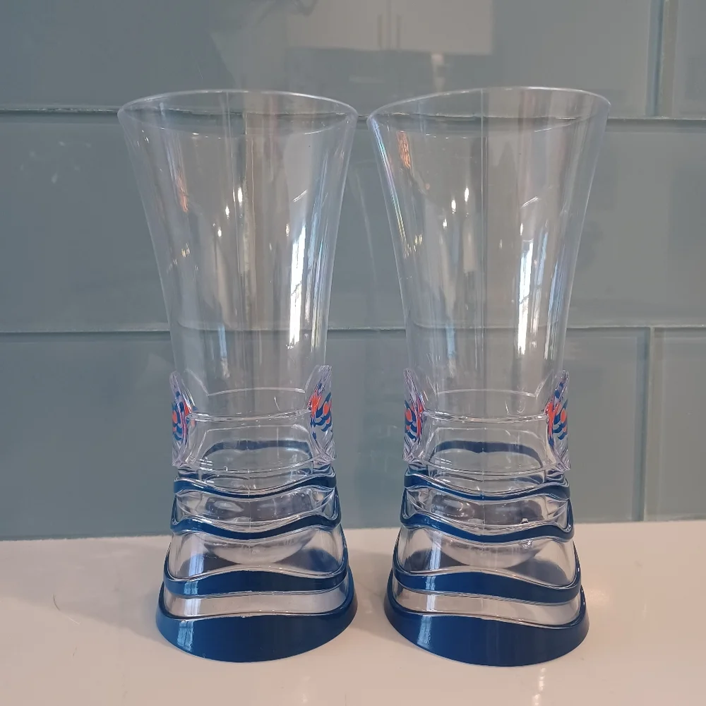 A pair of DCL souvenir cups